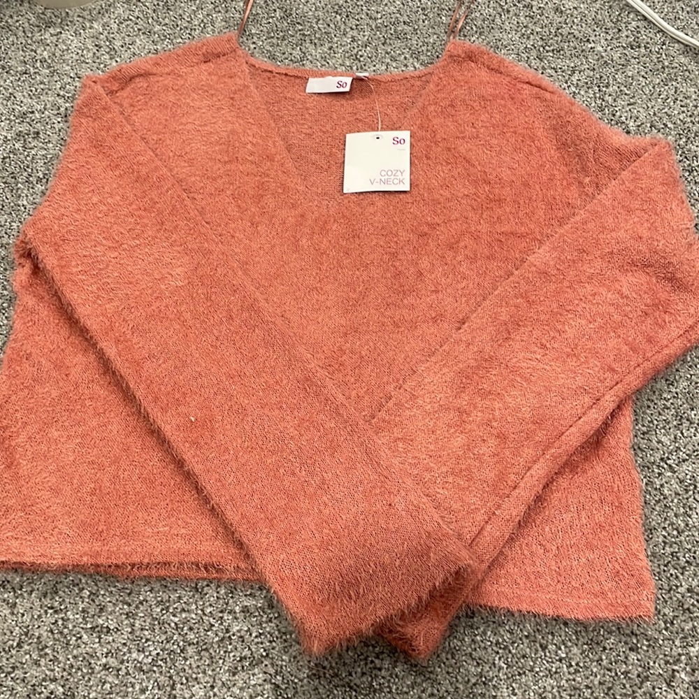 Nope pink color really fuzzy, v-neck by the brand SO from kohls
